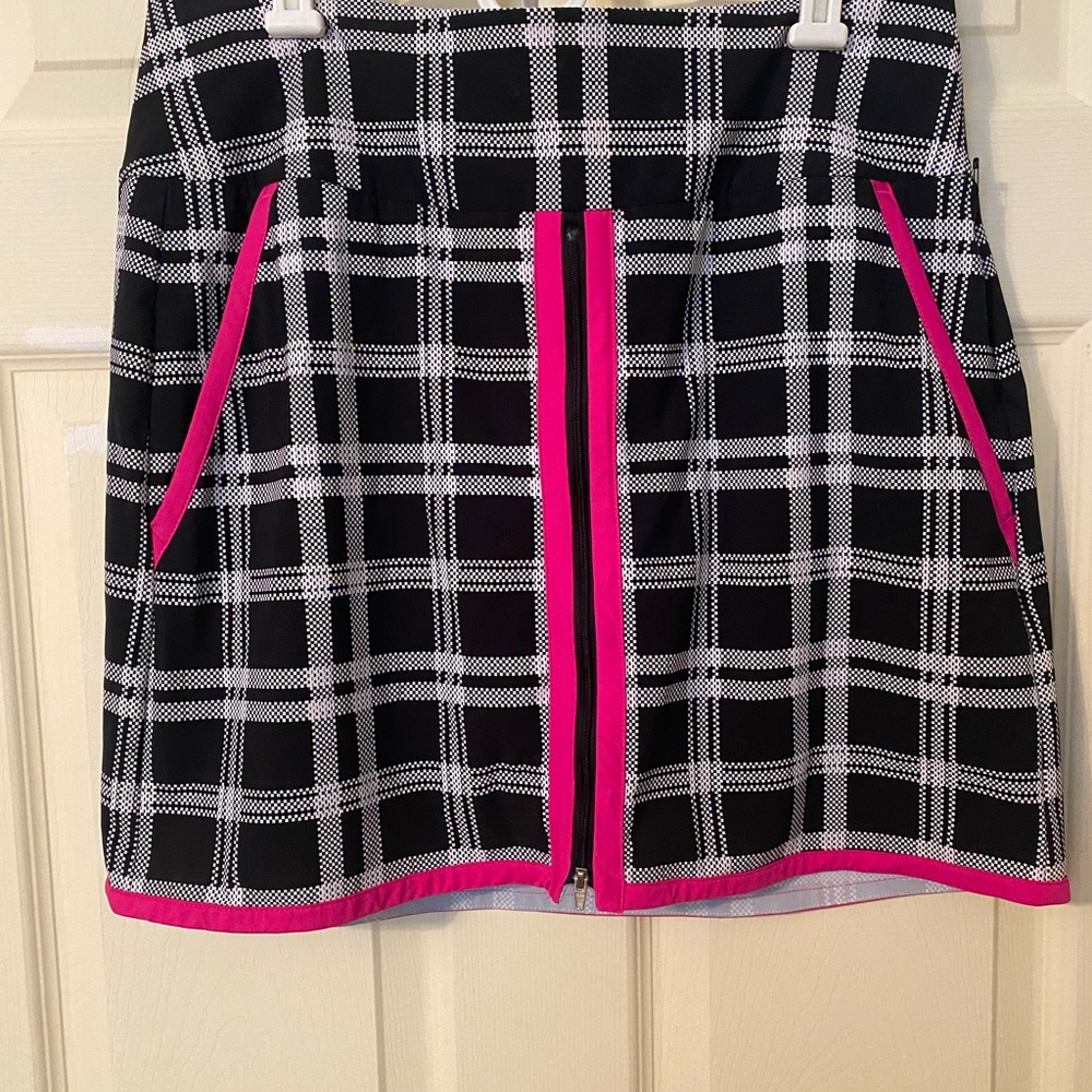 Kinona golf skort —size Large. Black and white plaid with pink accents.